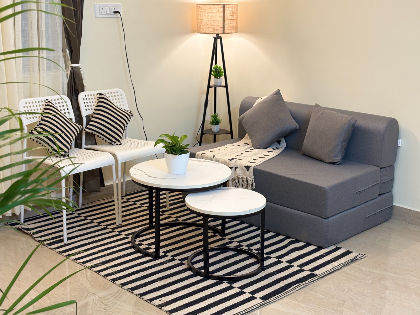 Nestive furnished living room with sofa, coffee table and decor